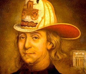 Benjamin Franklin wears a firefighter's hat.