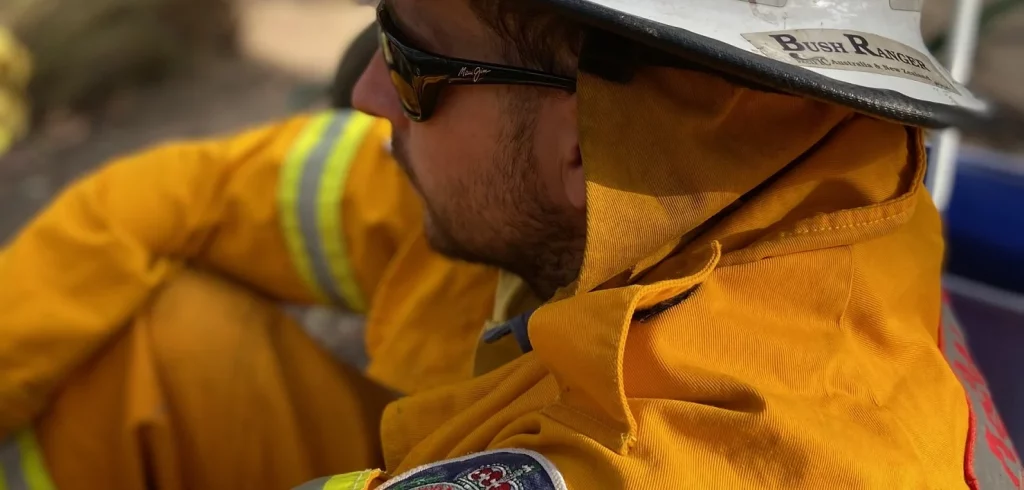 Hayden Hoflan rests after helping to fight fires in Wales.