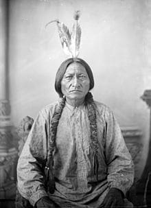 Sitting Bull poses for a photo in the 1800s.